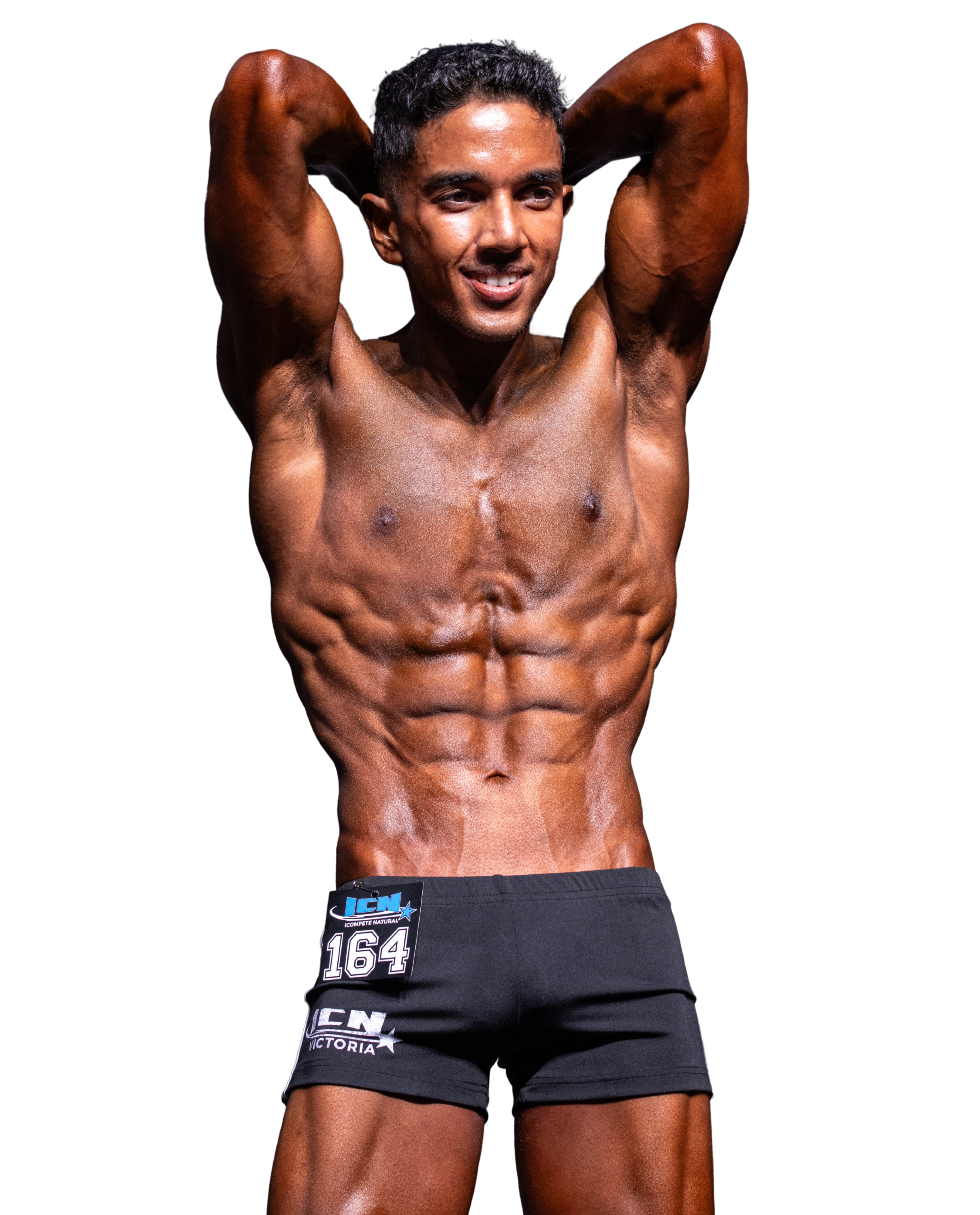 Athlete on stage showing lean physique